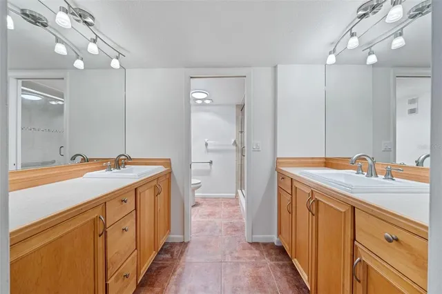 a view of a dining room with a sink and chandelier