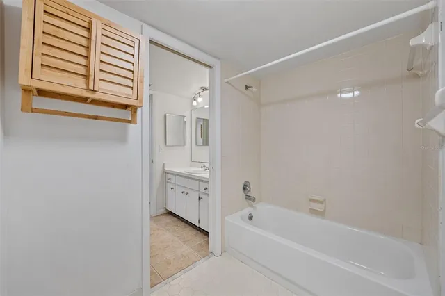 a view of a porch with a floor to ceiling window next to a yard