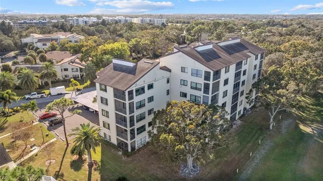 an aerial view of a house with a yard
