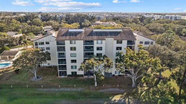 an aerial view of a house with a lake view