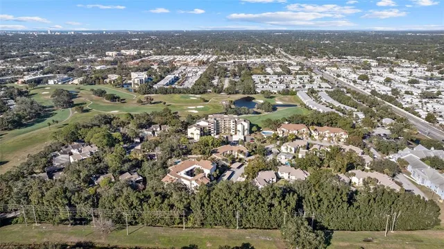 an aerial view of a residential houses with outdoor space