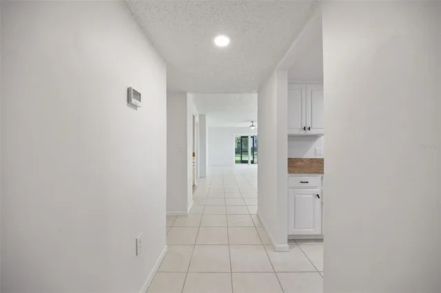 a view of a hallway with white walls