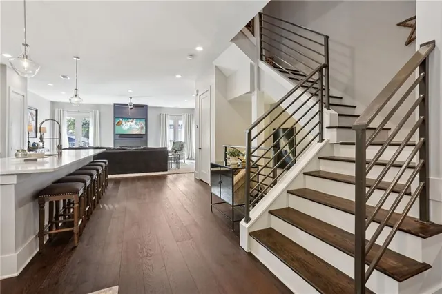 a view of entryway and hall with wooden floor