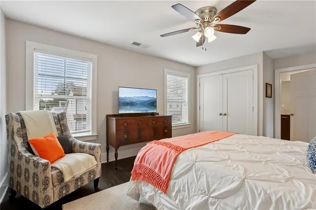 a bedroom with two beds and a chandelier