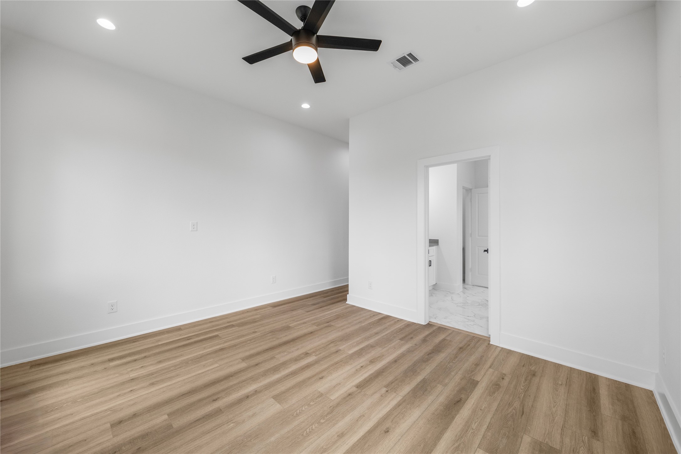 7901 Cora Street, Unit B Houston, TX 77088 - Photo 11 of 20 wooden floor in an empty room