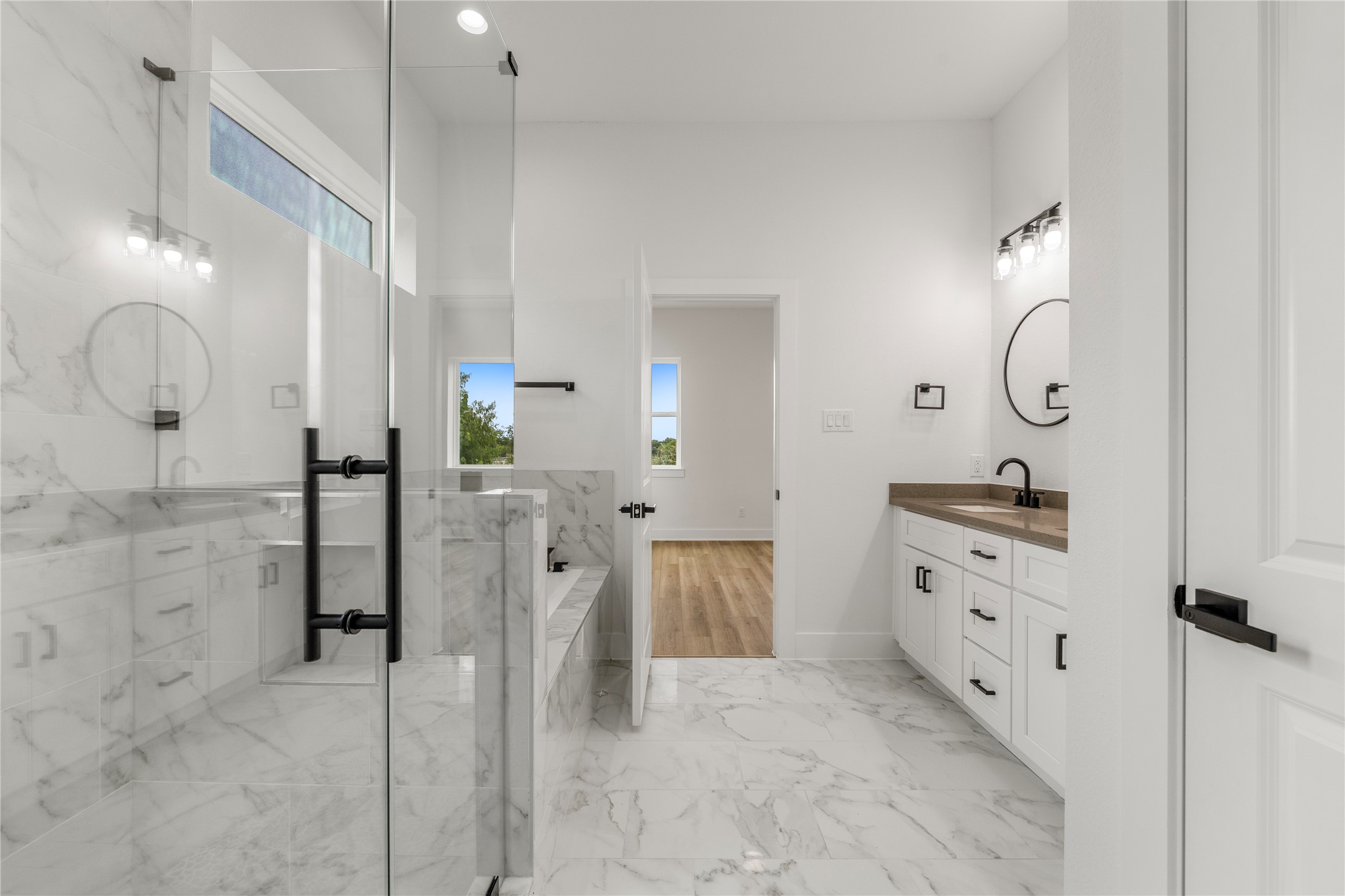 7901 Cora Street, Unit B Houston, TX 77088 - Photo 15 of 20 a spacious bathroom with double vanity and a shower