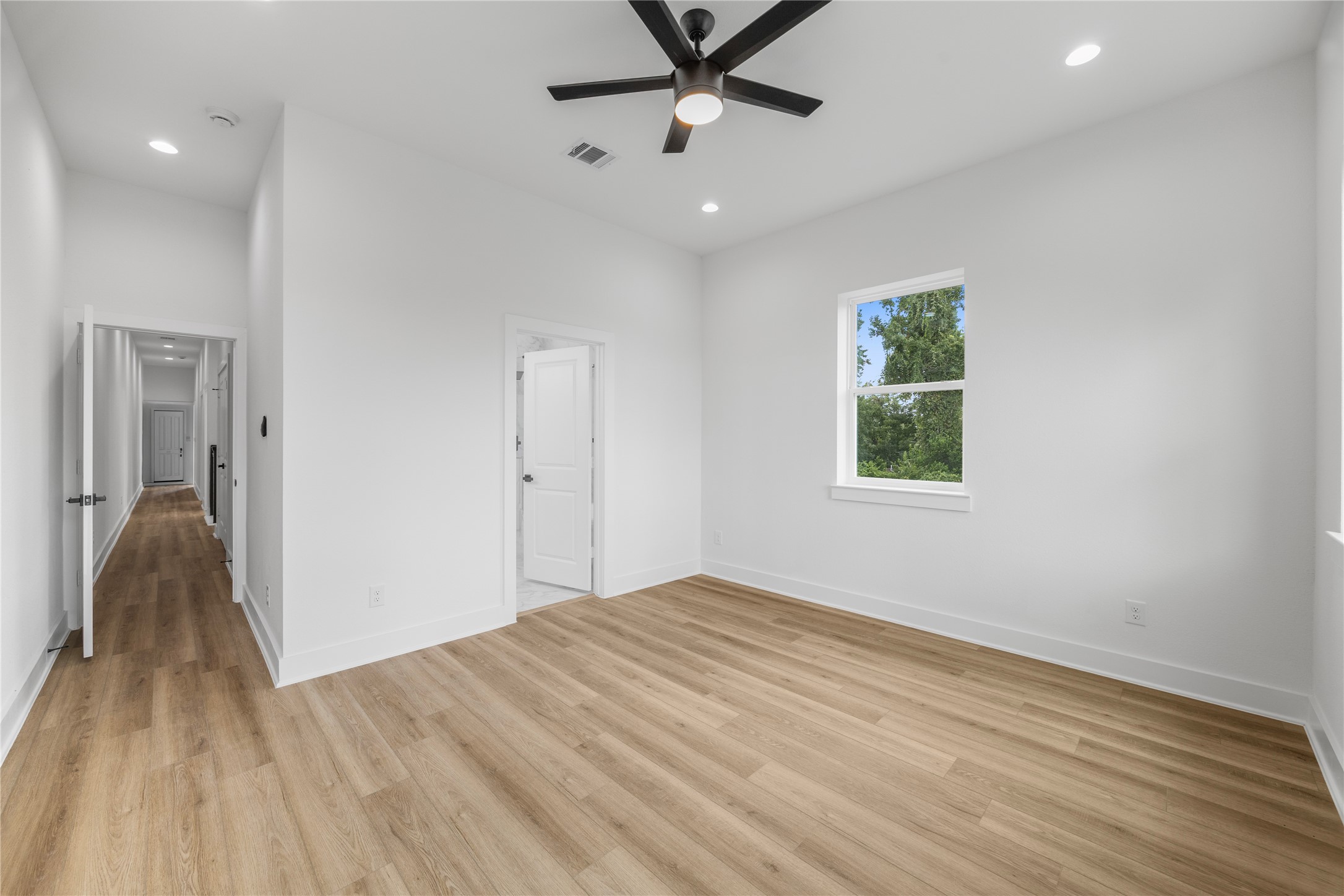 7901 Cora Street, Unit B Houston, TX 77088 - Photo 10 of 20 a view of an empty room with a window