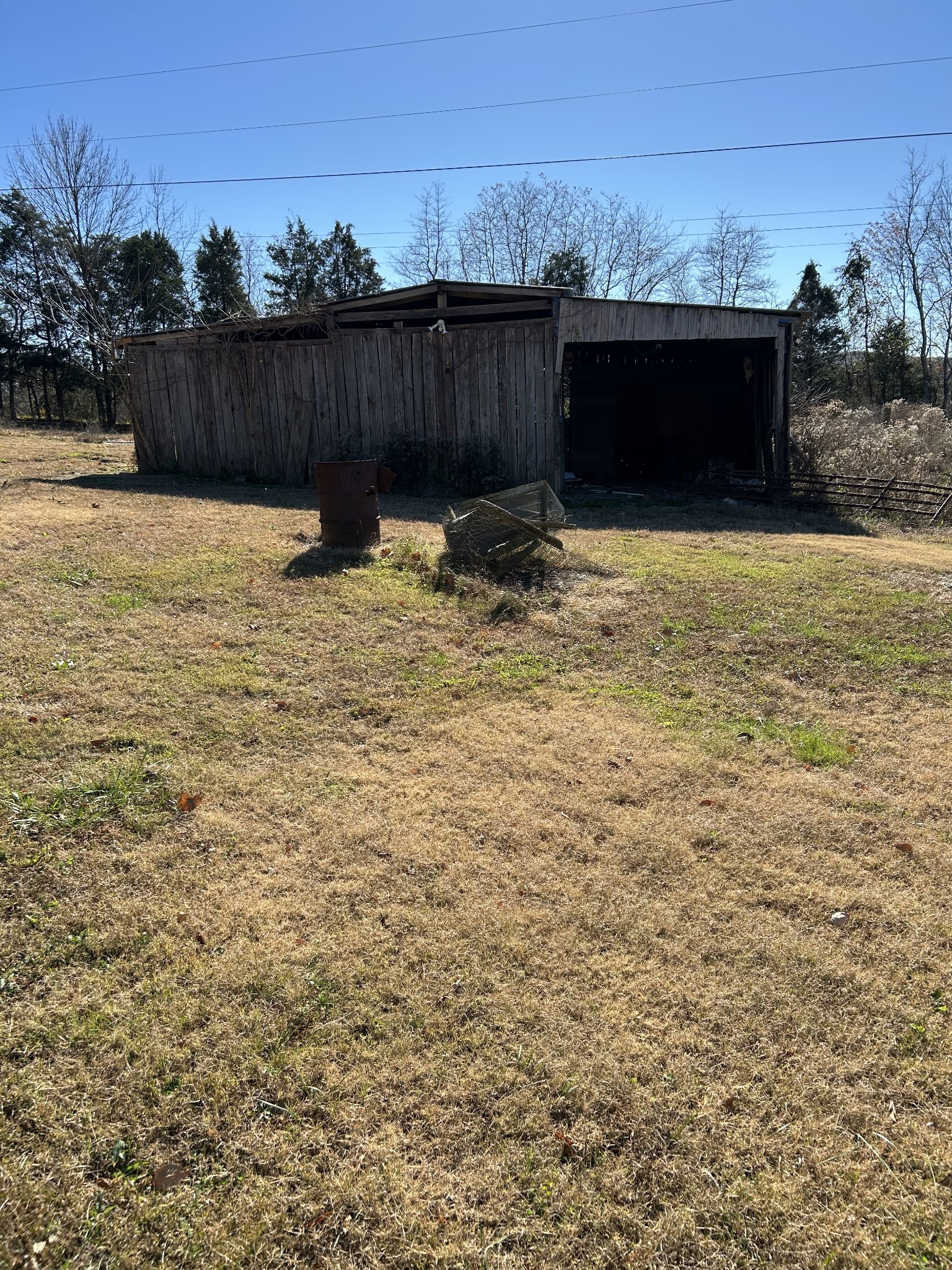 3122 Linwood Road Watertown, TN 37184 - Photo 6 of 13 a view of swimming pool with lawn chairs and wooden fence