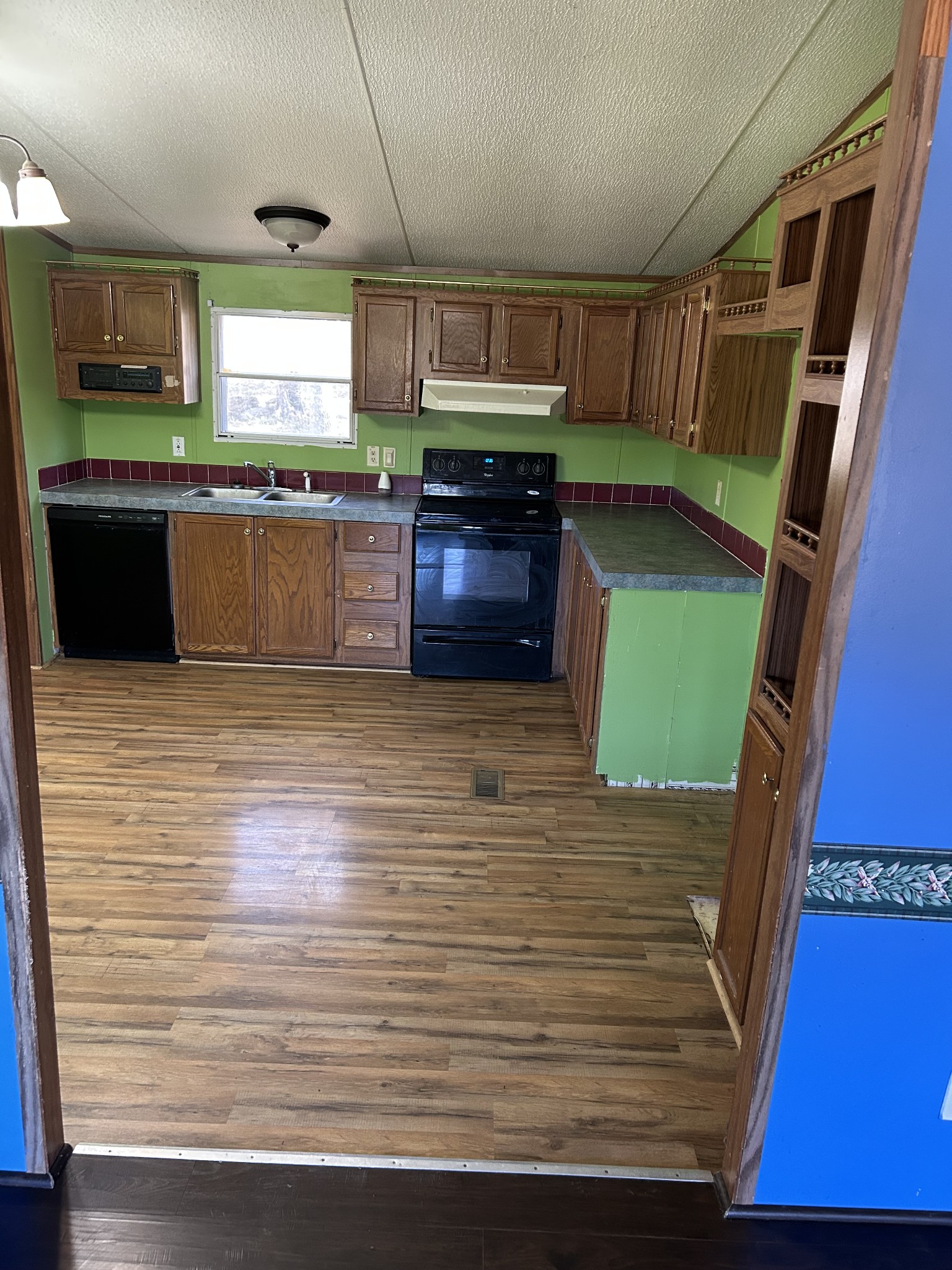 3122 Linwood Road Watertown, TN 37184 - Photo 7 of 13 a kitchen with cabinets and wooden floor