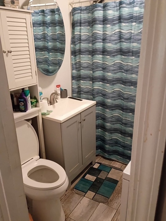 51 View Street Holyoke, MA 01040 - Photo 4 of 16 a bathroom with a toilet and a sink