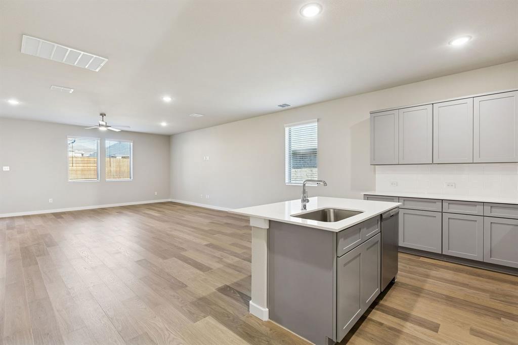 7712 Kingfisher Road Aubrey, TX 76227 - Photo 13 of 39 Open First Floor in the Haylee home plan by Trophy Signature Homes - REPRESENTATIVE PHOTO