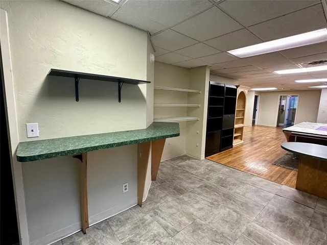 a kitchen with a stove a sink and a refrigerator