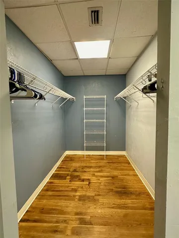 a view of a room with wooden floor and stairs