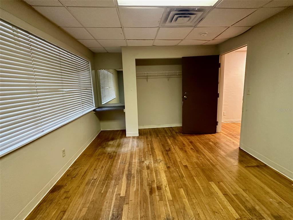 905 Southwest 8th Avenue Gainesville, FL 32601 - Photo 25 of 31 a view of a room with wooden floor and stairs