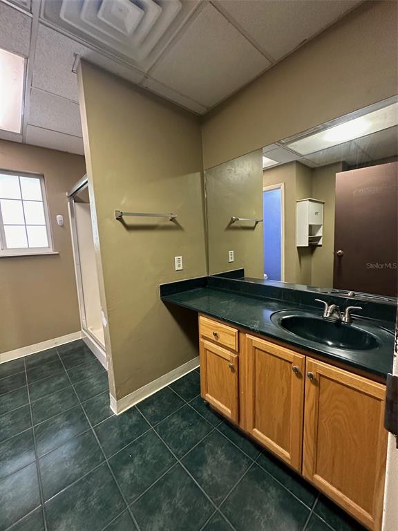 905 Southwest 8th Avenue Gainesville, FL 32601 - Photo 28 of 31 a bathroom with a sink and a mirror