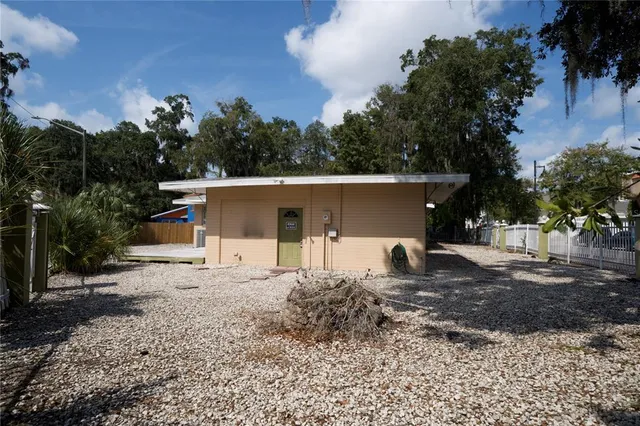 a house view with a backyard space