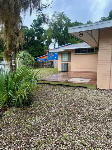 a house view with a backyard space
