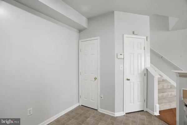 a spacious bedroom with a bed and a couch
