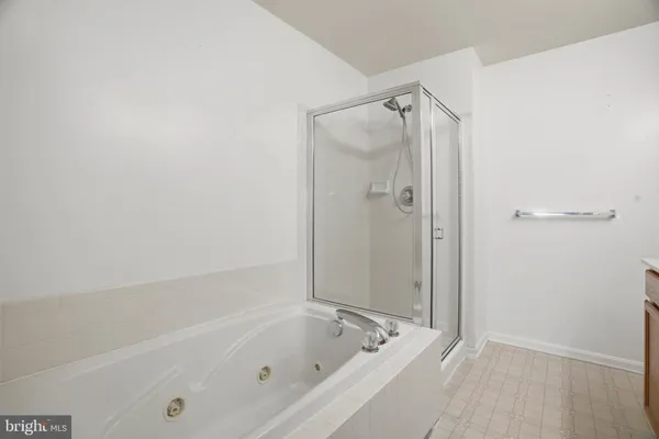 a bedroom with bed and a window