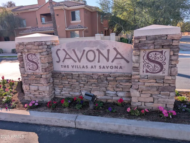 a street sign on a brick wall