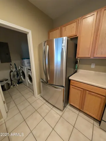 a kitchen with stainless steel appliances a refrigerator and a sink