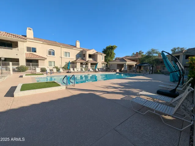 a view of multiple houses with outdoor space