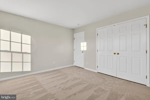 an empty room with windows and windows