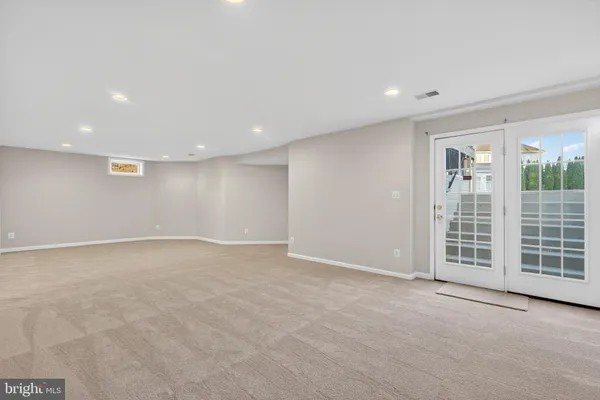 a view of a house with a wooden deck