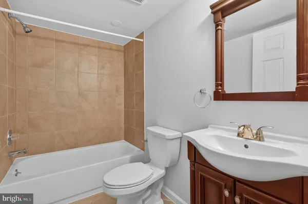 a view of a house with wooden deck