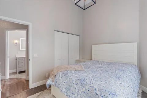 a bedroom with a bed and a shower