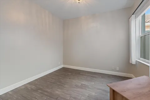 a room with window and wooden floor