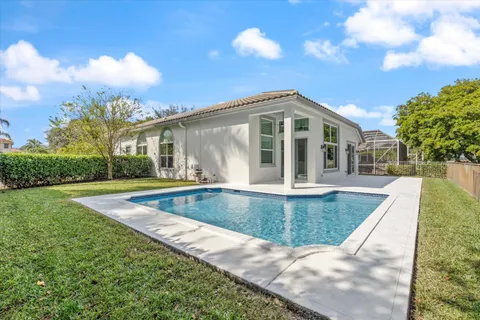 a view of a house with swimming pool