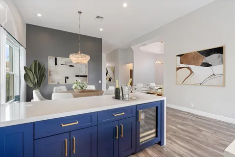 a bathroom with a sink a large mirror and vanity