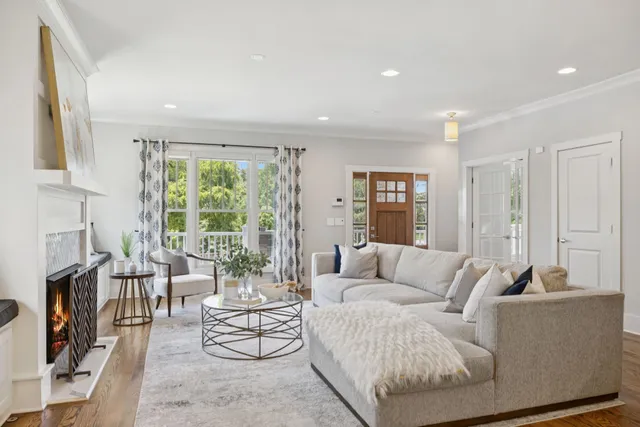 a kitchen with kitchen island granite countertop a stove refrigerator and cabinets