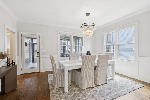 a kitchen with stainless steel appliances granite countertop a sink a stove and a refrigerator