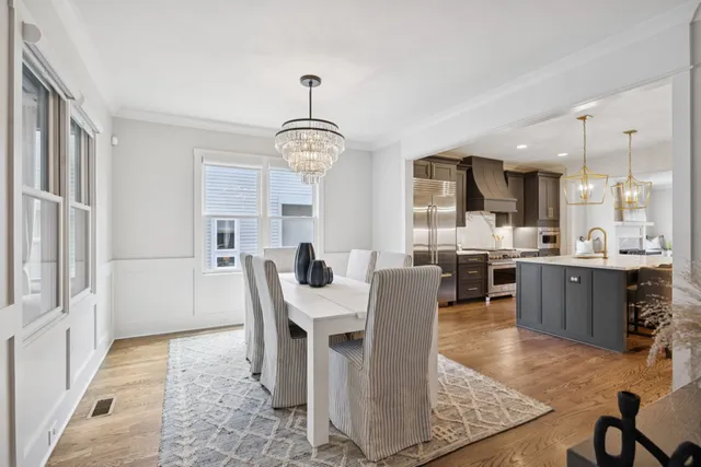 a large white kitchen with a large window