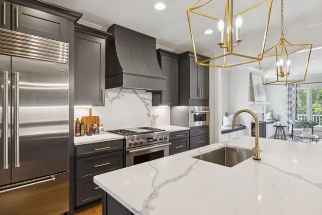 an empty room with chandelier fan and windows