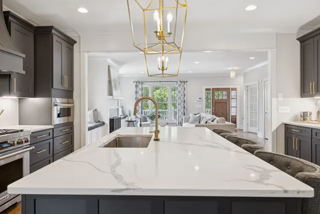 a utility room with sink dryer and washer