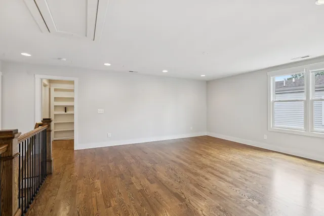 a bedroom with a large bed and a large window
