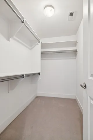 a white bath tub sitting next to a white sink