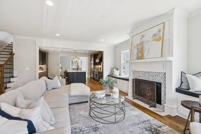 a living room with furniture a window and a fireplace