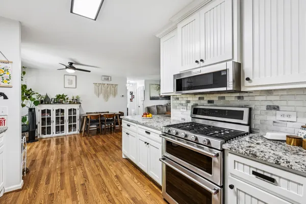 a kitchen with a table and chairs