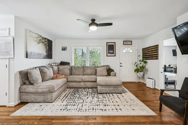 a view of a dining room with furniture window and wooden floor