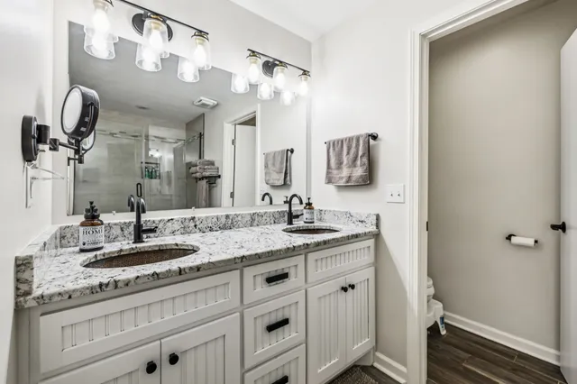 a living room with furniture a flat screen tv and a window