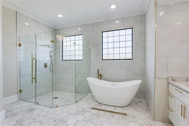 a bathroom with a bathtub and shower