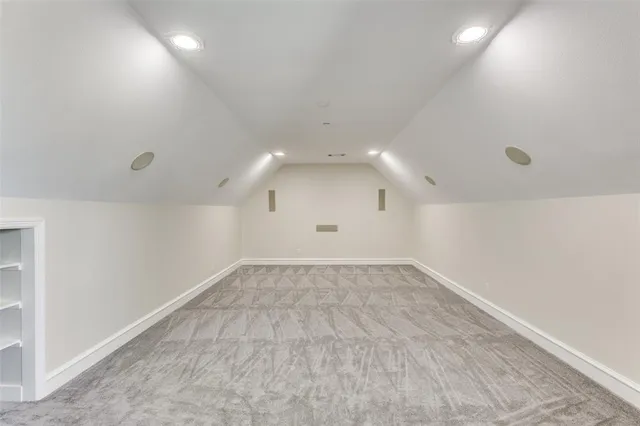 an empty room with a empty space and windows