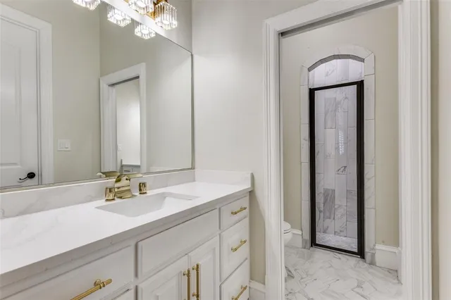 a bathroom with a sink vanity and mirror