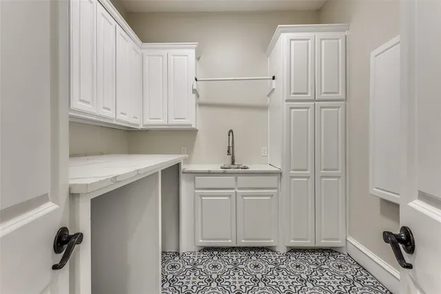 a kitchen with stainless steel appliances granite countertop a sink and cabinets
