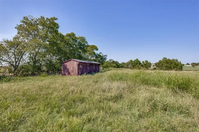 a backyard of a house with lots of green space