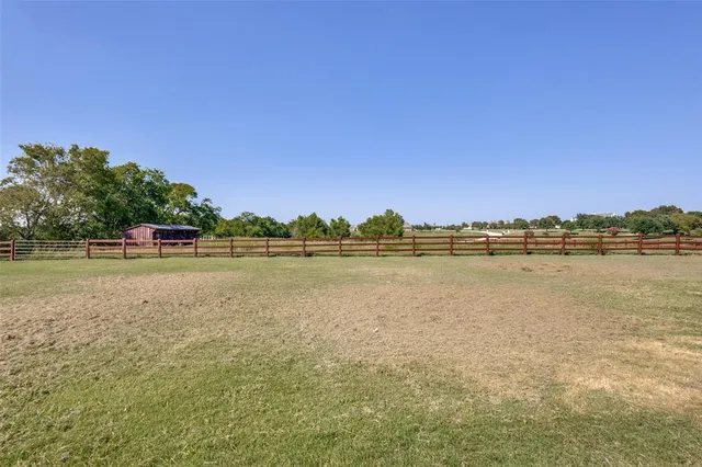 a view of a lake with houses in the background